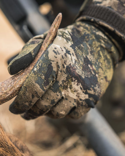 InVis MPC Green coloured Seeland Grip Camo Gloves on forest background #colour_invis-mpc-green