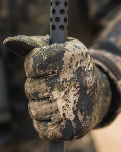 InVis MPC Green coloured Seeland Grip Camo Gloves on forest background #colour_invis-mpc-green