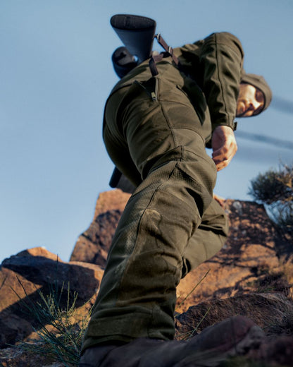 Pine Green Coloured Seeland Hawker Shell II Waterproof Trousers on outdoor background #colour_pine-green