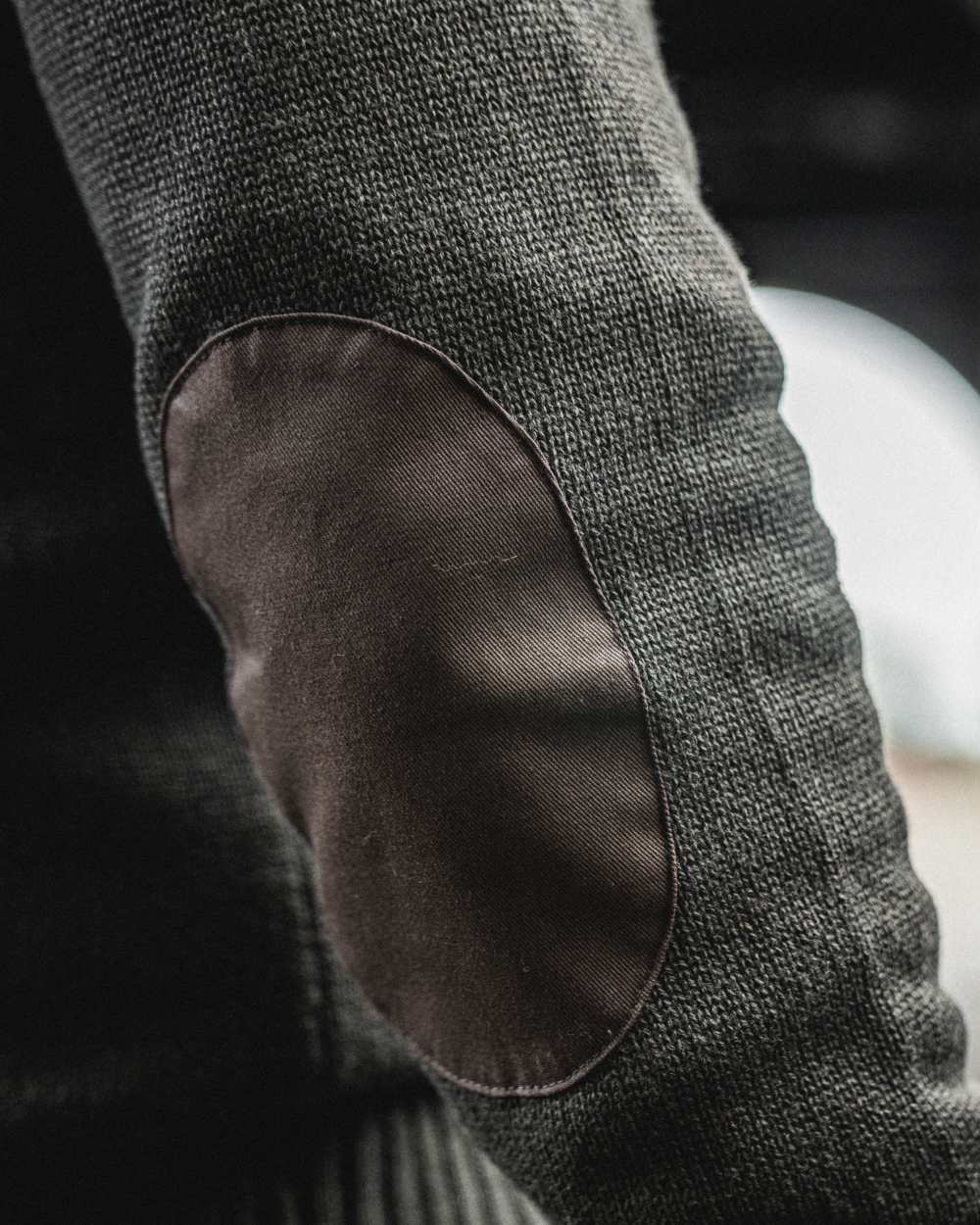 Dark Brown Coloured Seeland Haze Windbreaker Knit On A blurry Background #colour_dark-brown