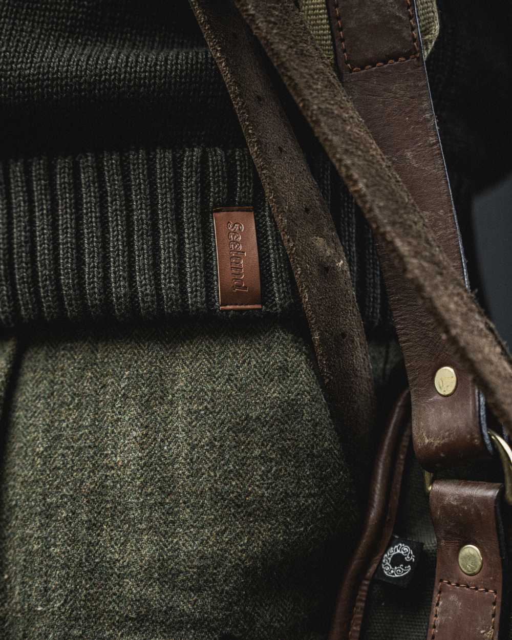 Dark Brown Coloured Seeland Haze Windbreaker Knit On A blurry Background #colour_dark-brown