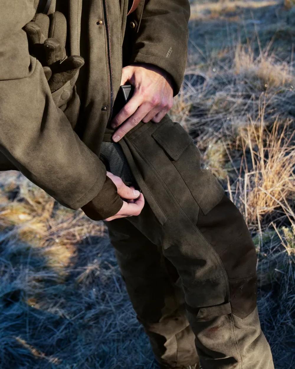 Grizzly Brown Coloured Seeland Helt II Waterproof Trousers on outdoor background #colour_grizzly-brown