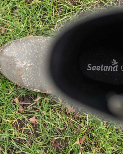 Pine Green Coloured Seeland Hillside Enforced Wellingtons on outdoor background #colour_pine-green