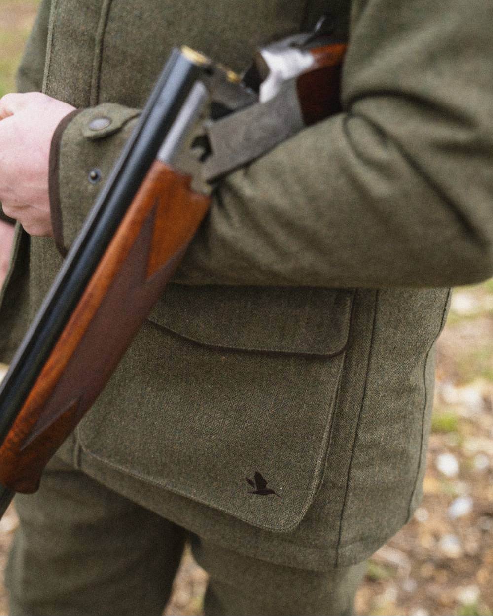 Moss Green Coloured Seeland Hillside Jacket on outdoor background #colour_moss-green