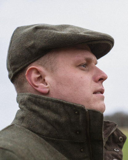 Moss Green Coloured Seeland Hillside Sixpence Cap on outdoor background #colour_moss-green