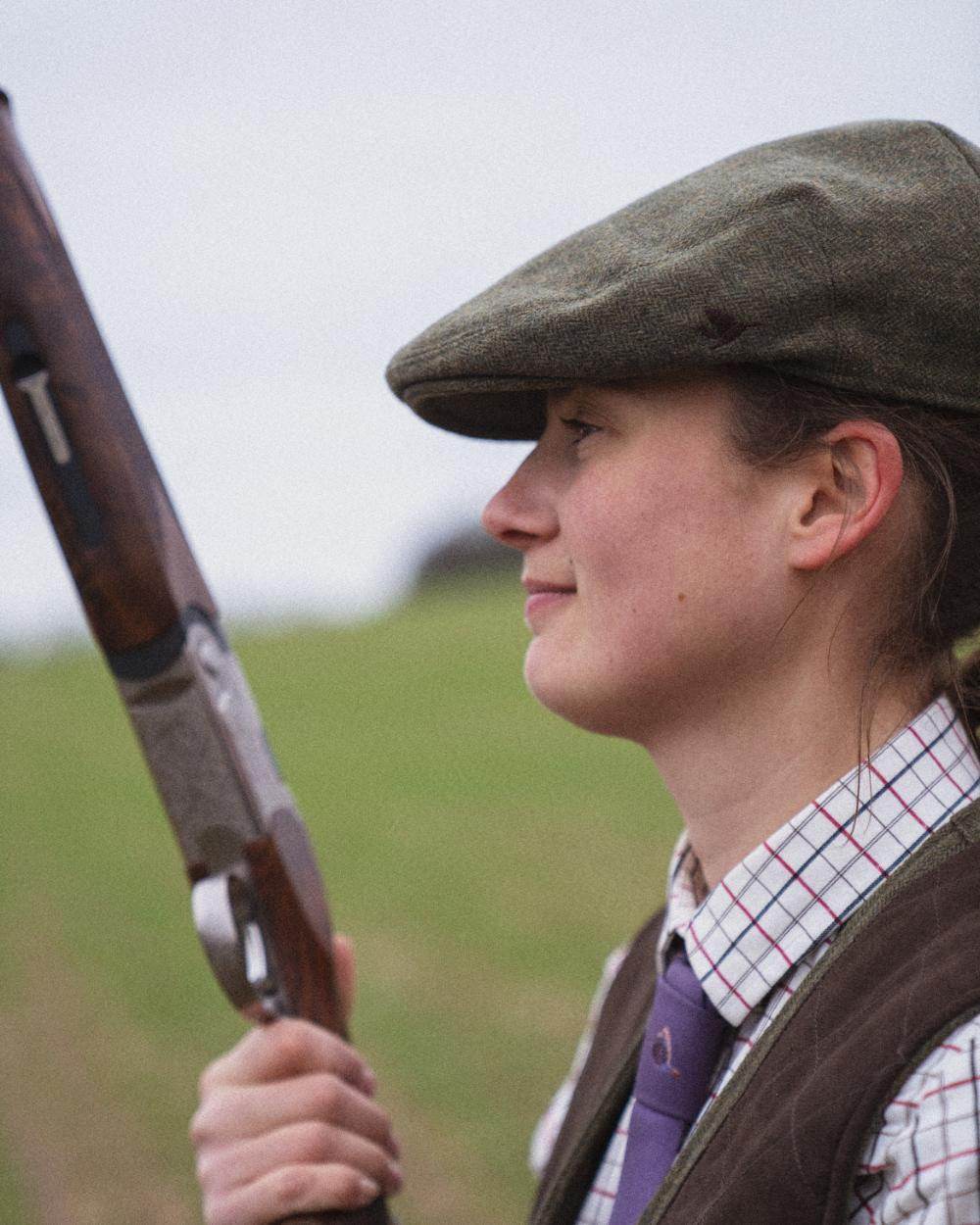 Moss Green Coloured Seeland Hillside Sixpence Cap on outdoor background #colour_moss-green