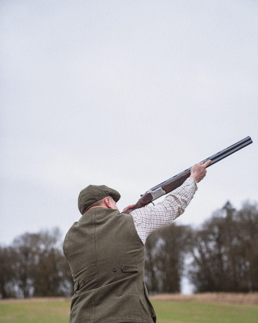 Moss Green Coloured Seeland Hillside Waistcoat on outdoor background #colour_moss-green