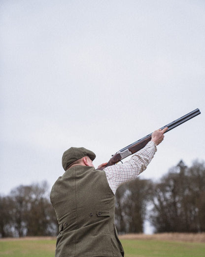 Moss Green Coloured Seeland Hillside Waistcoat on outdoor background #colour_moss-green