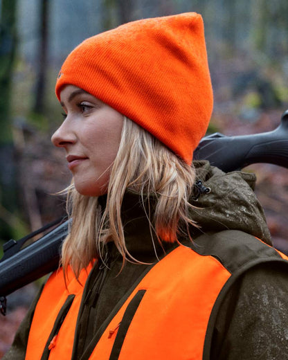 Hi-Vis Orange Pine Green Coloured Seeland Ian Reversible Beanie Hat on outdoor background #colour_hi-vis-orange-pine-green