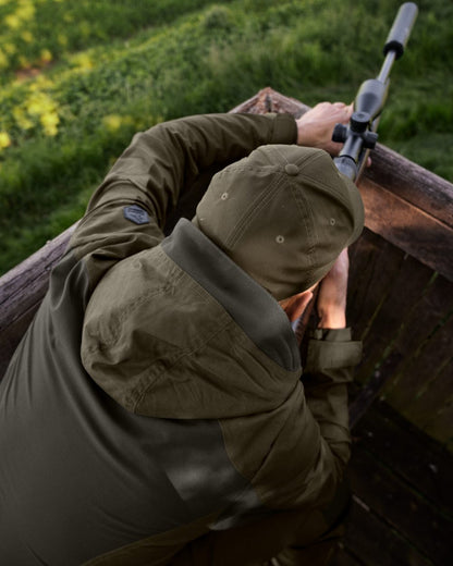 Pine Green Coloured Seeland Key-Point Active II Jacket on forest background #colour_pine-green
