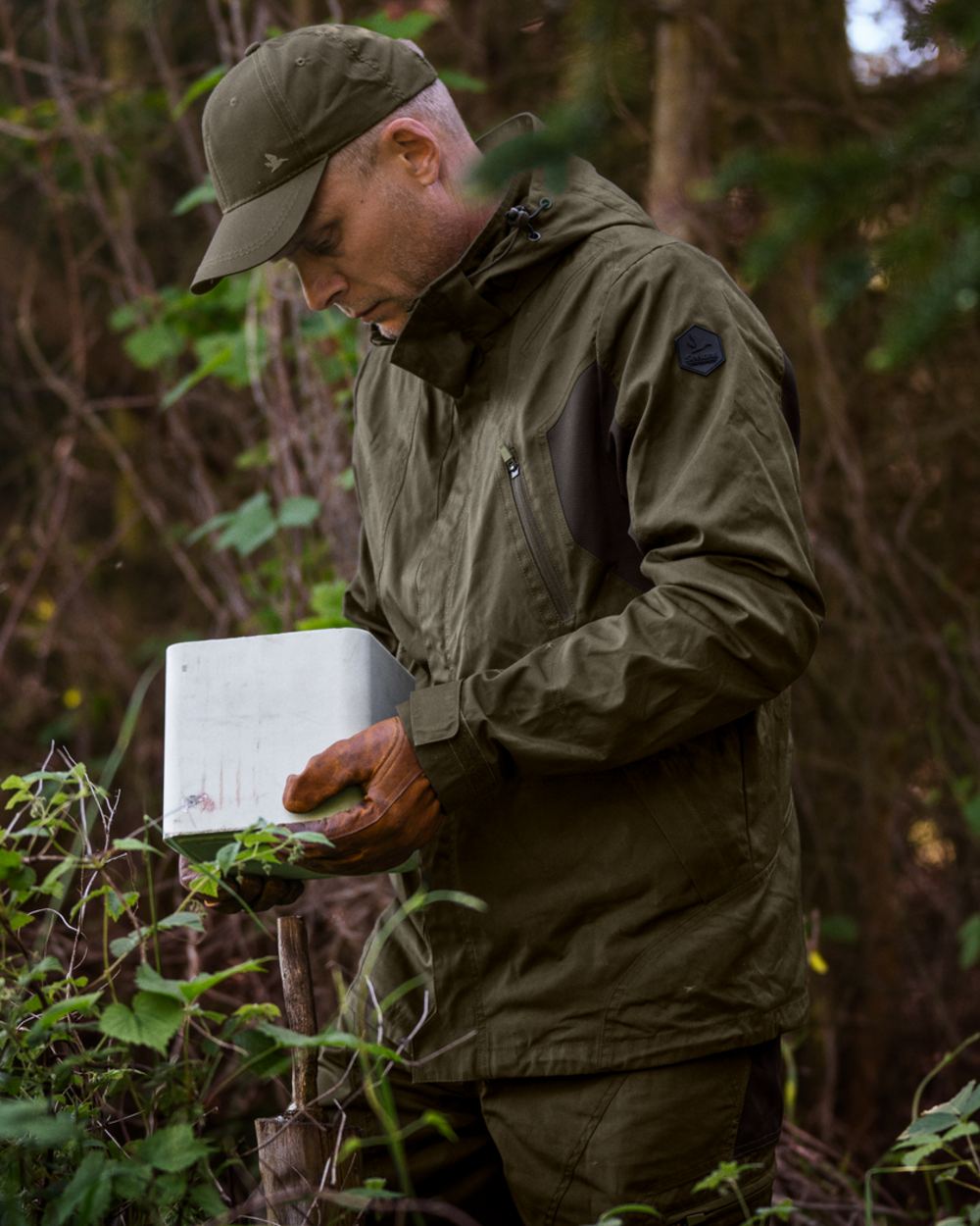 Pine Green Coloured Seeland Key-Point Active II Jacket on forest background #colour_pine-green