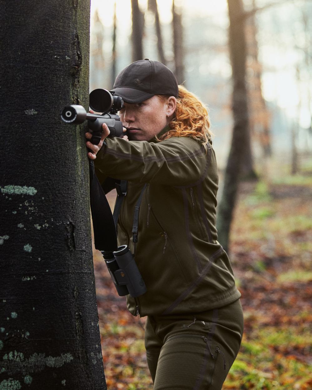 Pine Green coloured Seeland Ladies Hawker Advance Jacket on forest background #colour_pine-green