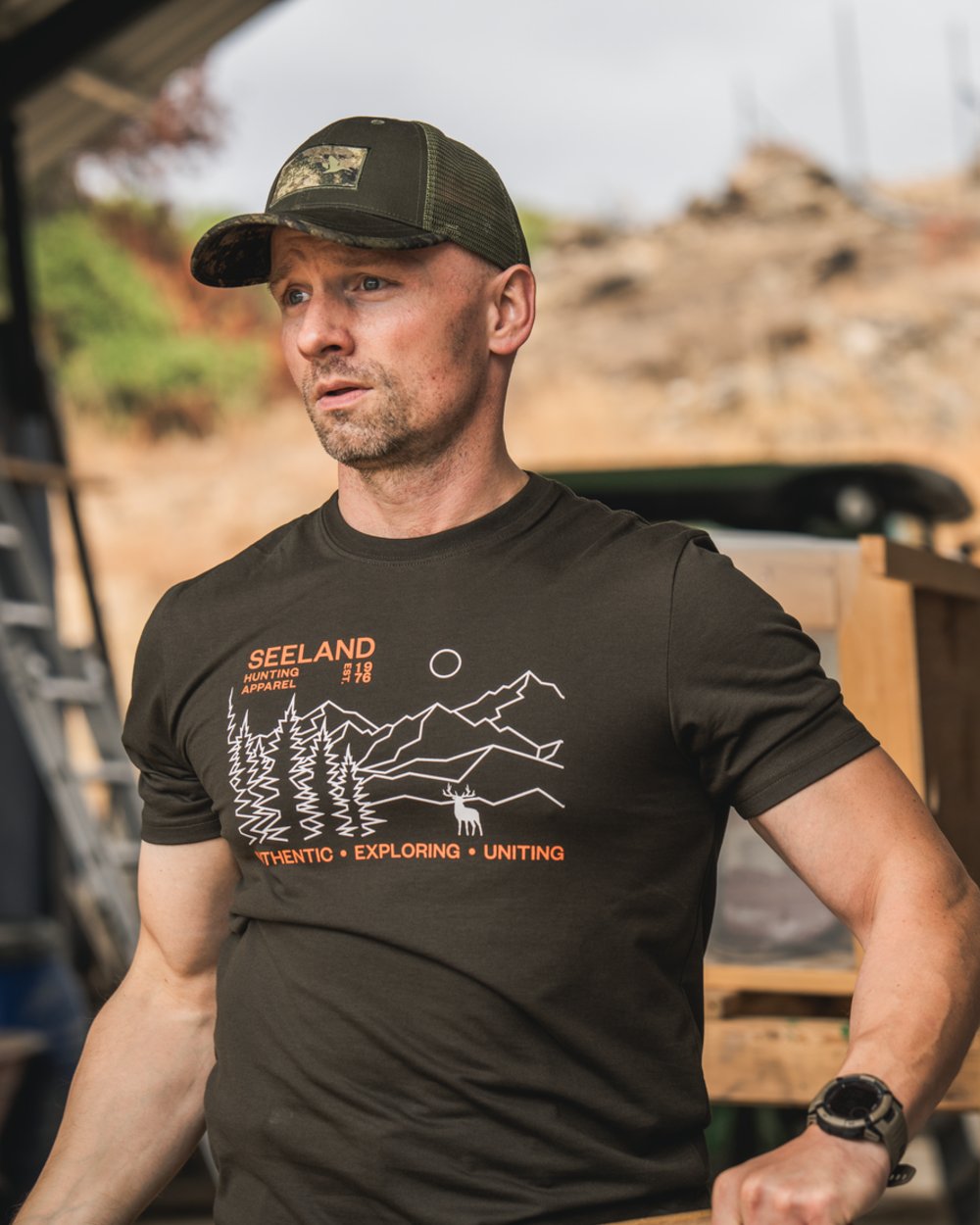 Pine Green Coloured Seeland Landscape T-Shirt on outdoor background #colour_pine-green