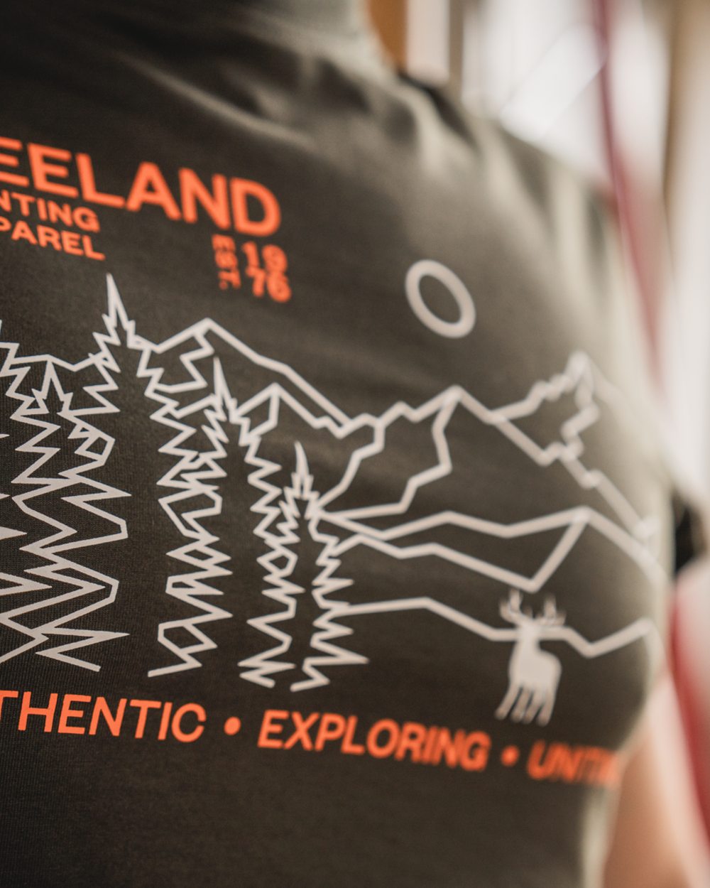 Pine Green Coloured Seeland Landscape T-Shirt on outdoor background #colour_pine-green