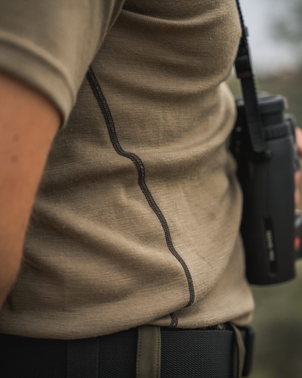 Covert Green Coloured Seeland Mens Apex Merino T-Shirt on mountain background #colour_covert-green