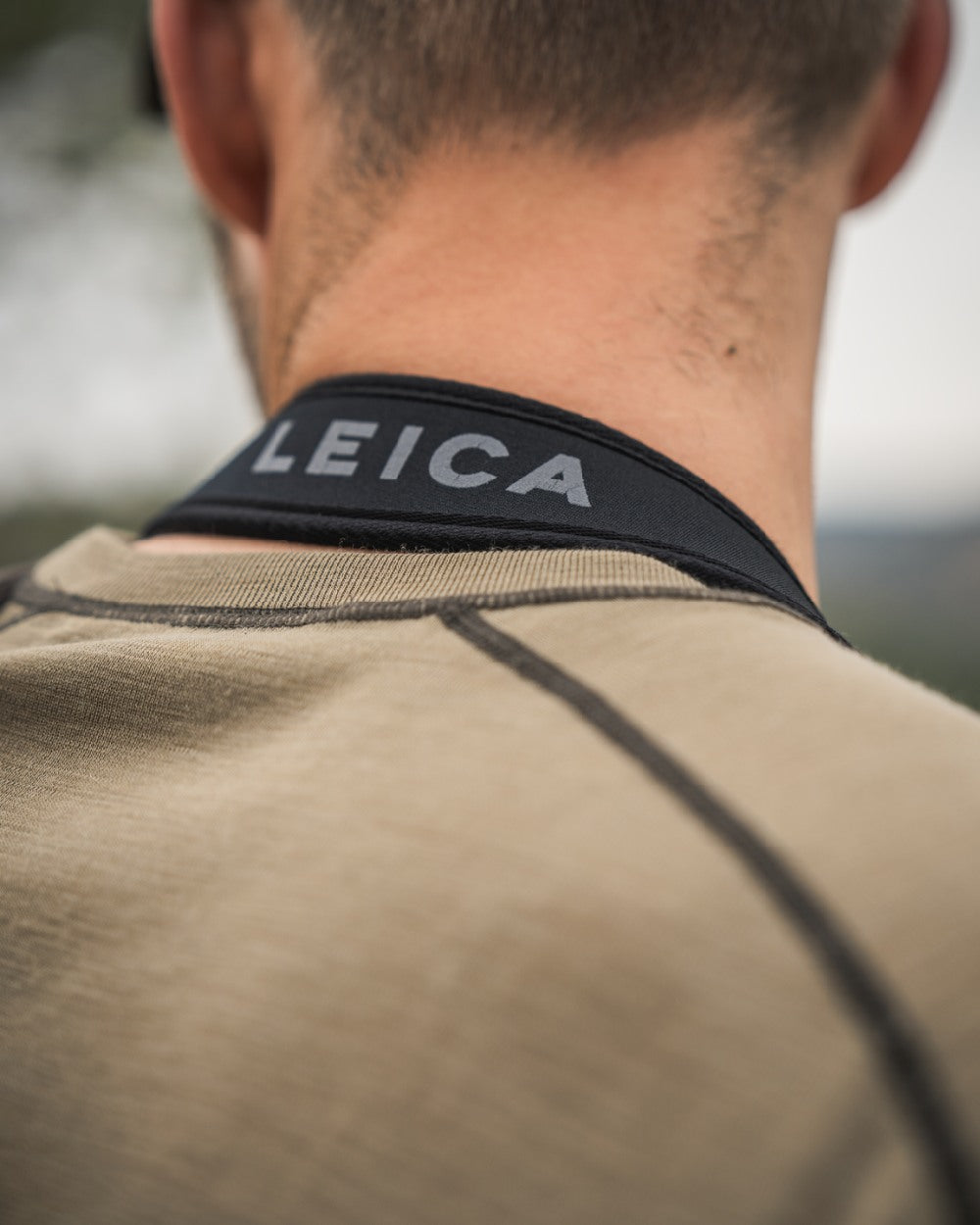 Covert Green Coloured Seeland Mens Apex Merino T-Shirt on mountain background #colour_covert-green