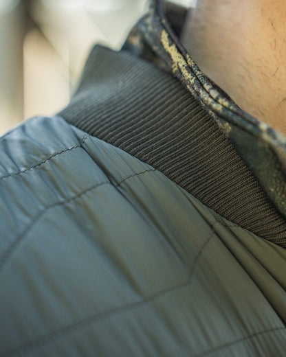 Grape Leaf Coloured Seeland Mens Celsius Heat Liner Waistcoat on outdoor background #colour_grape-leaf