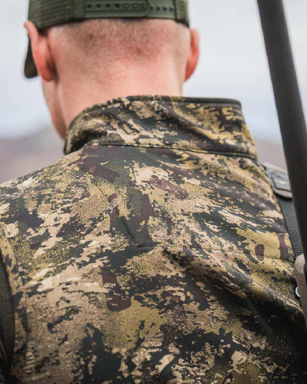 InVis MPC Green Coloured Seeland Mens Chaser Aero Camo Waistcoat on mountain background #colour_invis-mpc-green