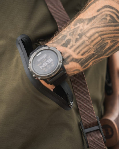 Pine Green Coloured Seeland Mens Chaser Aero Waistcoat on mountain background #colour_pine-green