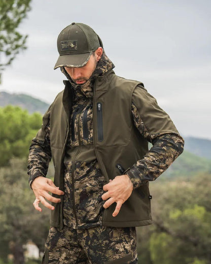 Pine Green Coloured Seeland Mens Chaser Aero Waistcoat on mountain background #colour_pine-green
