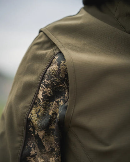 Pine Green Coloured Seeland Mens Chaser Aero Waistcoat on mountain background #colour_pine-green