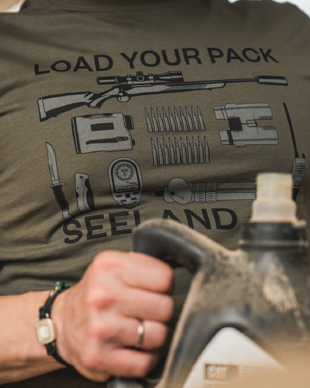 Grape Leaf Coloured Seeland Mens Packing T-Shirt on blurry background #colour_grape-leaf