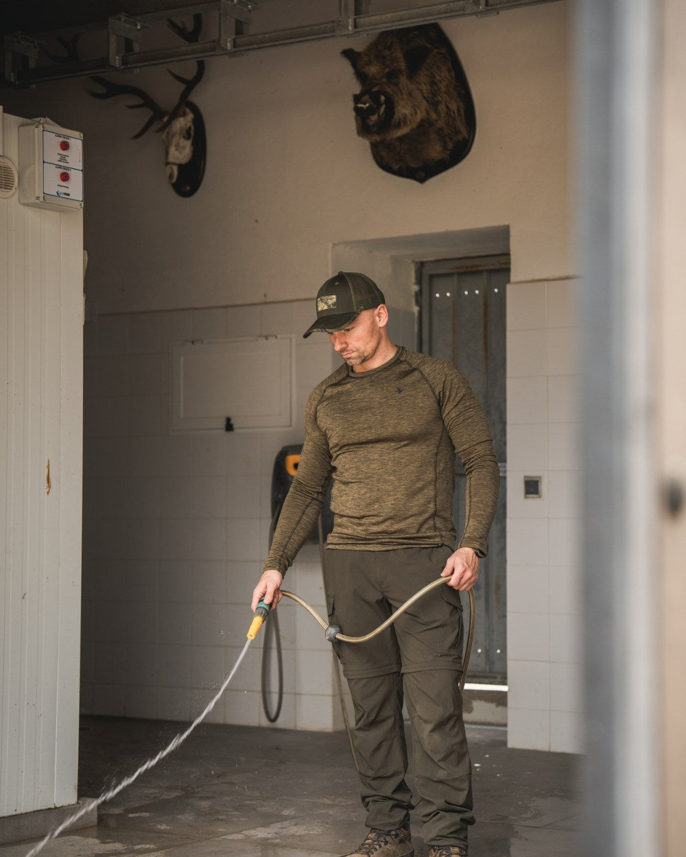 Military Olive Melange Coloured Seeland Peak T-shirt on Indoor Background
#colour_military-olive-melange