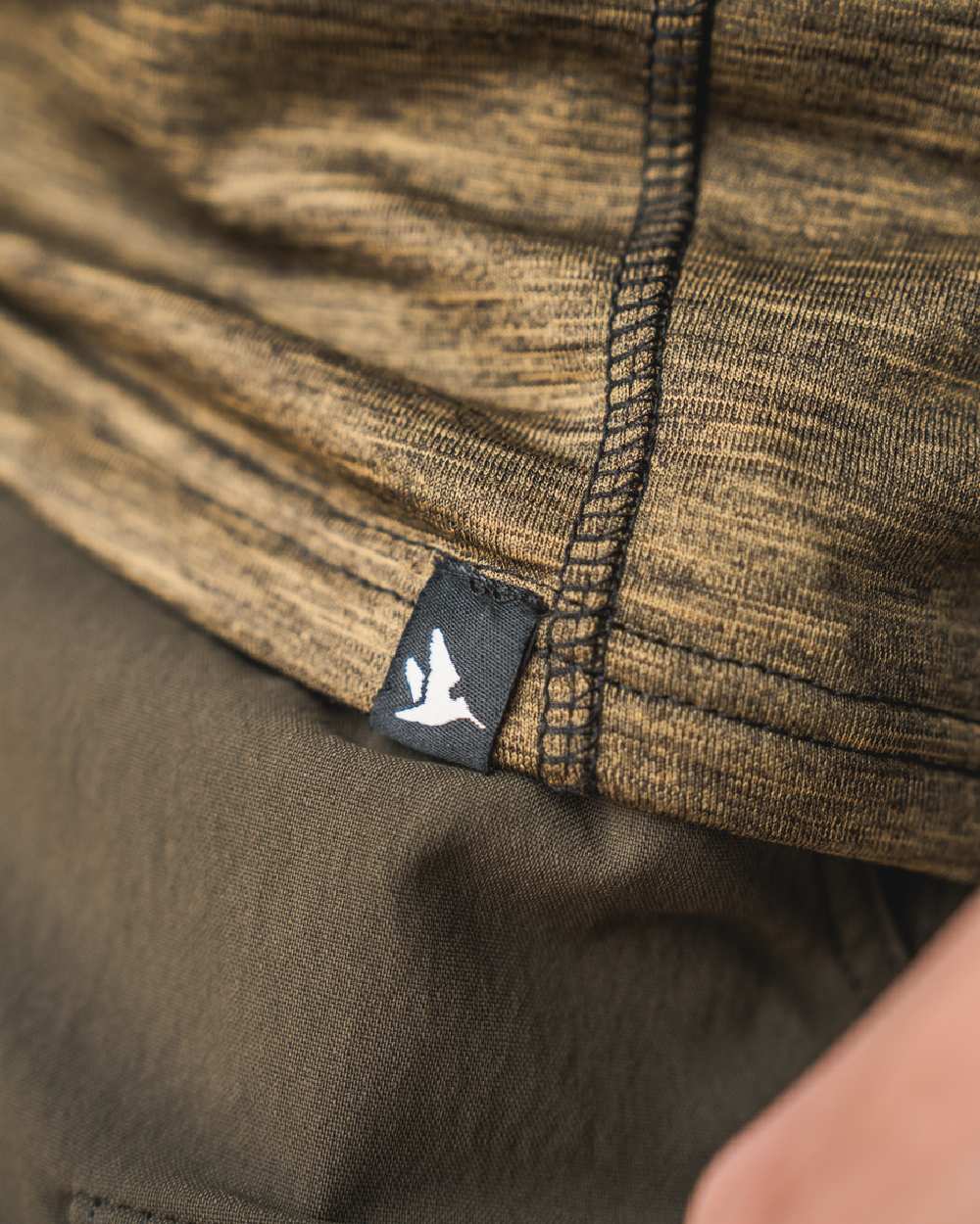 Military Olive Melange Coloured Seeland Peak T-shirt on Close up Background
#colour_military-olive-melange