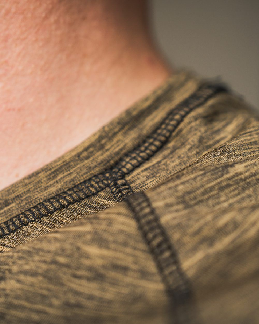 Military Olive Melange Coloured Seeland Peak T-shirt on Blurry Background
#colour_military-olive-melange