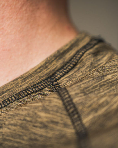 Military Olive Melange Coloured Seeland Peak T-shirt on Blurry Background
#colour_military-olive-melange