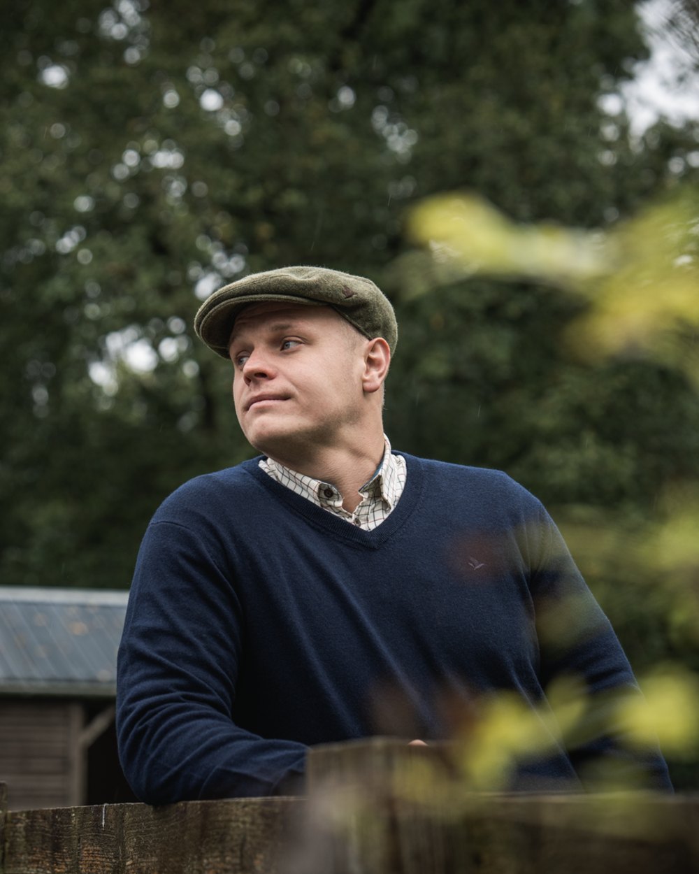 Dark Sapphire Coloured Seeland Mens Pine V-Neck Pullover on outdoor background #colour_dark-sapphire