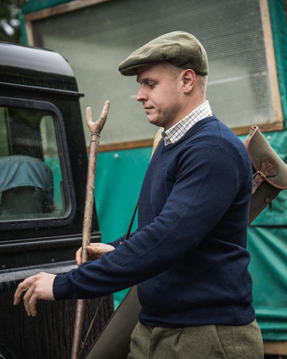 Dark Sapphire Coloured Seeland Mens Pine V-Neck Pullover on outdoor background #colour_dark-sapphire