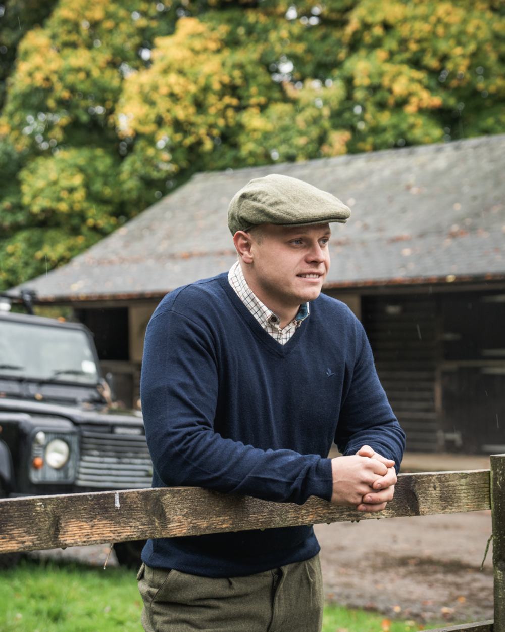 Dark Sapphire Coloured Seeland Mens Pine V-Neck Pullover on outdoor background #colour_dark-sapphire