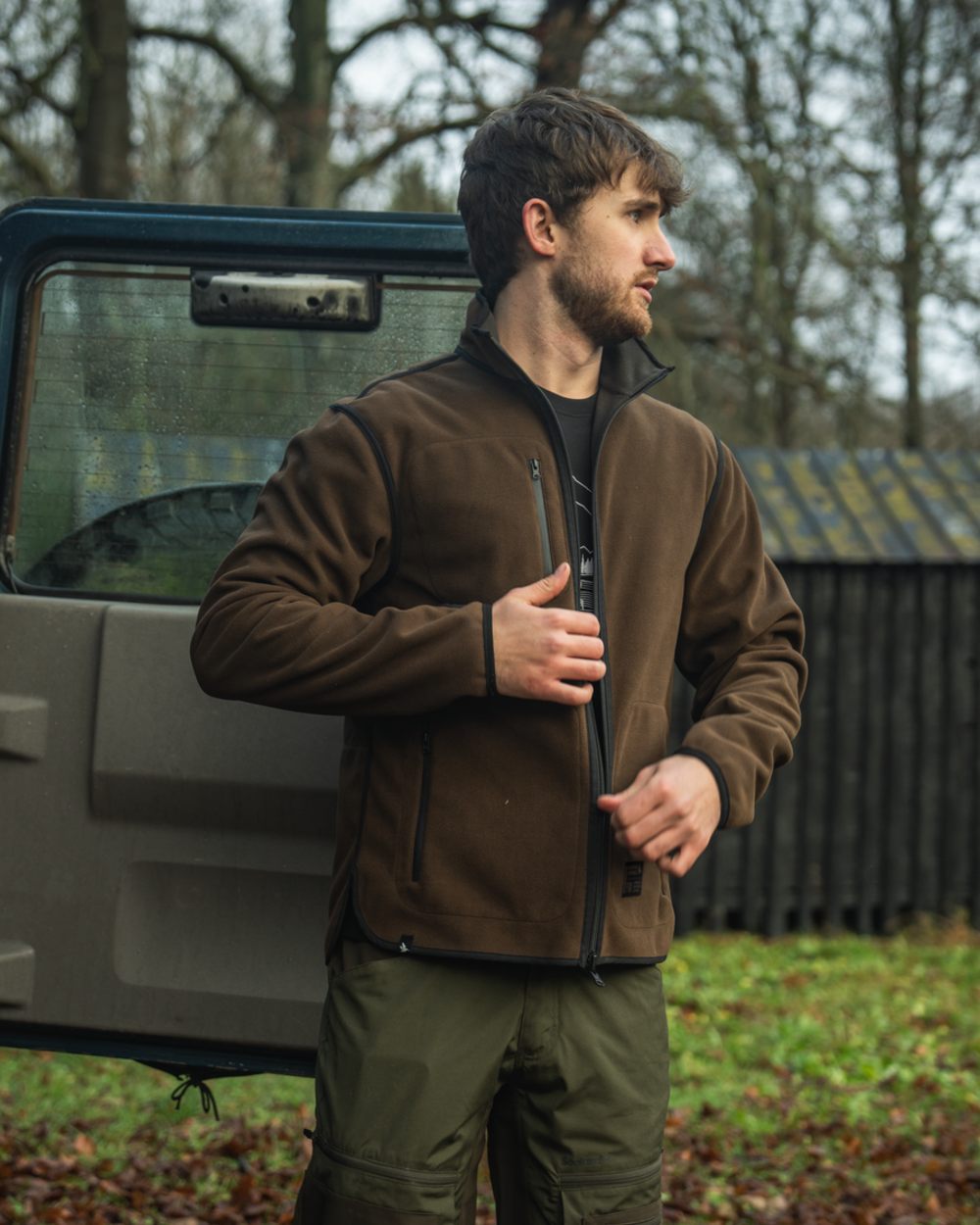 Grizzly Brown Demitasse Brown Coloured Seeland Mens Rogue Solid Reversible Fleece Jacket on forest background #colour_grizzly-brown-demitasse-brown