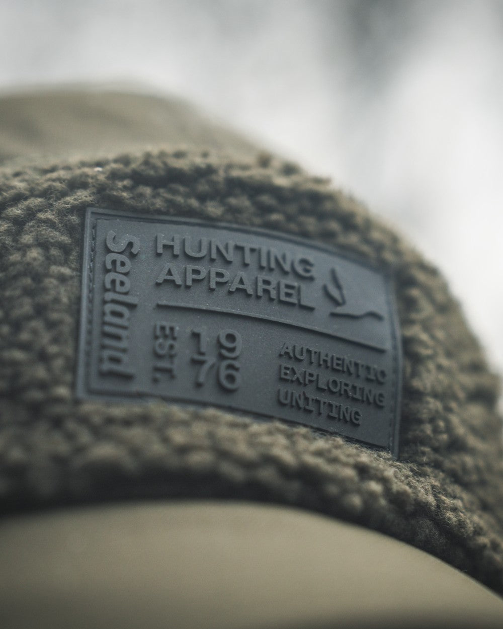 Pine Green coloured Seeland Mens Teddy Fold Down Cap on fog background #colour_pine-green