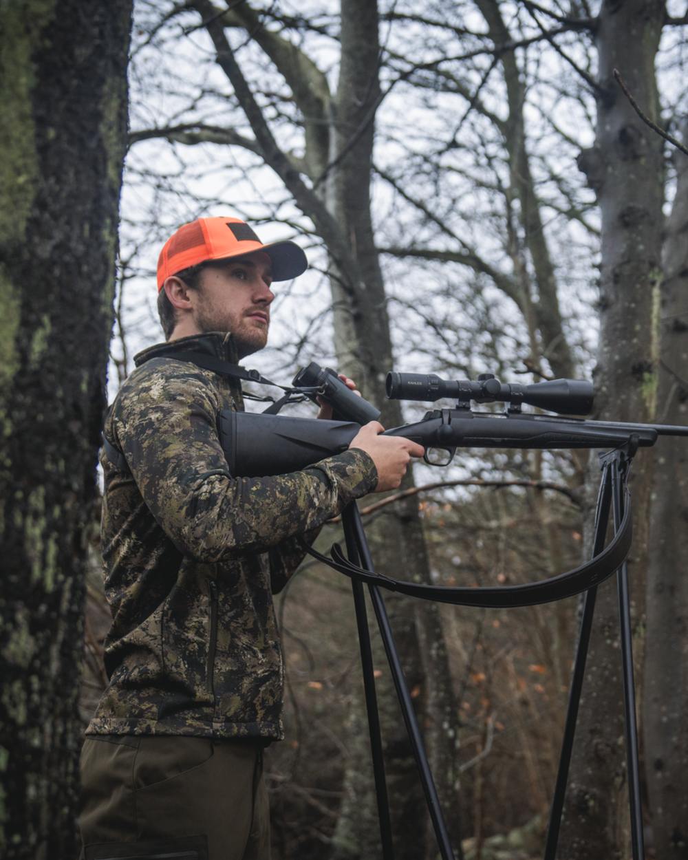 InVIS MPC Green Coloured Seeland Mens Tidal Camo Fleece Jacket on forest background #colour_invis-mpc-green