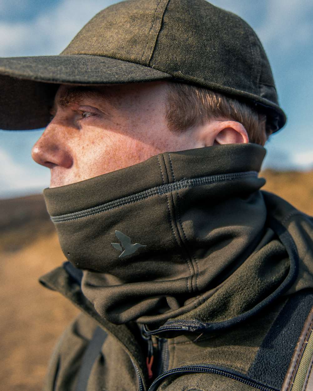 Pine Green Coloured Seeland Neck Gaiter on outdoor background #colour_pine-green