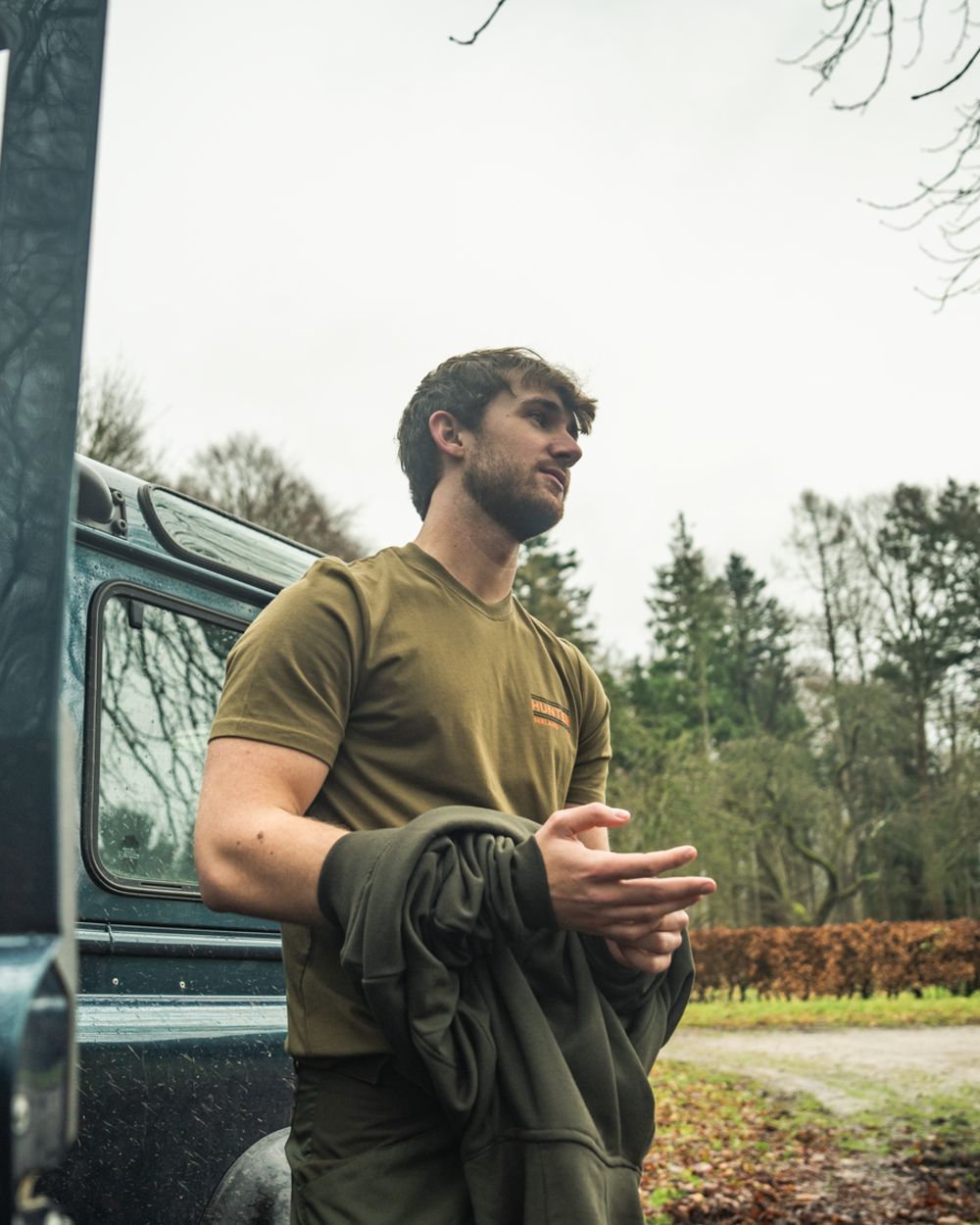 Military Olive Coloured Seeland On Point T-Shirt on outdoor background #colour_military-olive