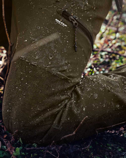 Pine Green Coloured Seeland Outdoor Membrane Trousers on outdoor background #colour_pine-green