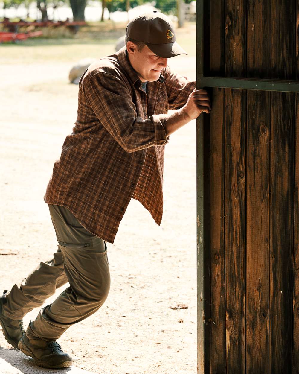 Pine Green Coloured Seeland Outdoor Stretch Trousers on outdoor background #colour_pine-green