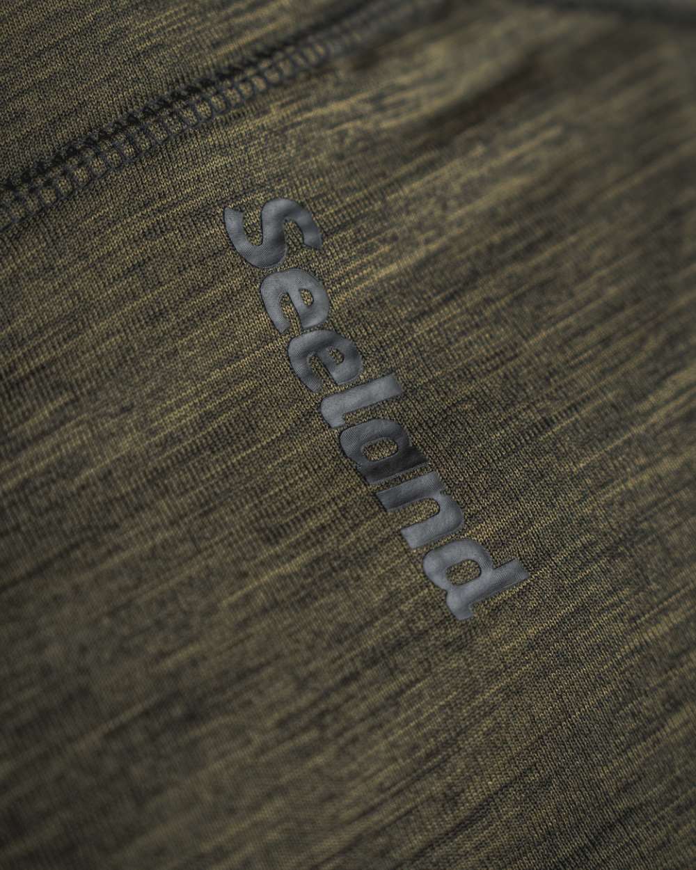 Pine Green Melange Coloured Seeland Peak Half Zip on outdoor background #colour_pine-green-melange