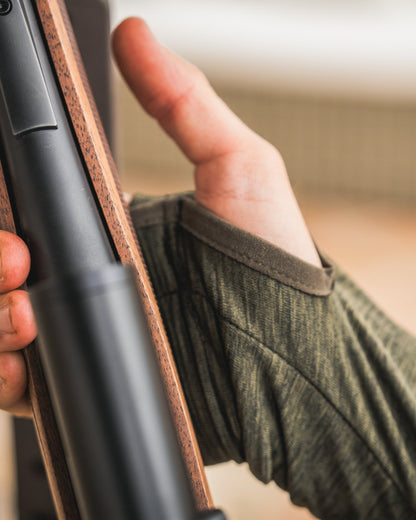 Pine Green Melange Coloured Seeland Peak Half Zip on outdoor background #colour_pine-green-melange