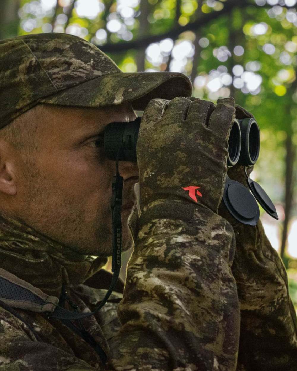 InVis Green Coloured Seeland Scent Control Camo Balaclava on forest background #colour_invis-green