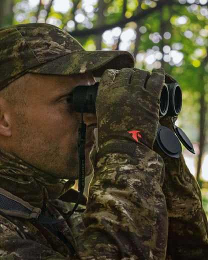 InVis Green Coloured Seeland Scent Control Camo Balaclava on forest background #colour_invis-green