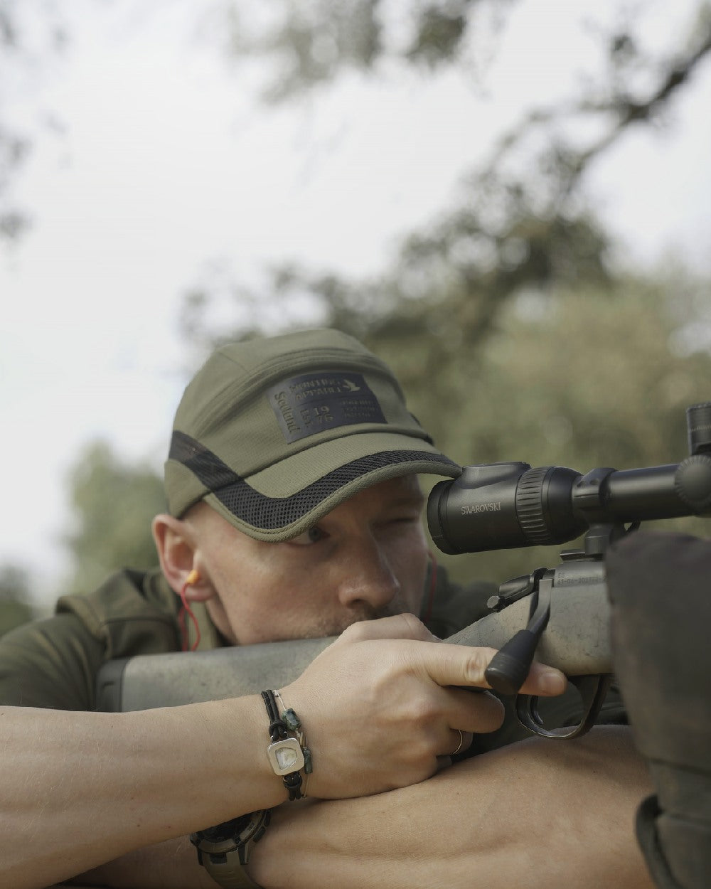 Grape Leaf Coloured Seeland Selous Cap on forest background #colour_grape-leaf