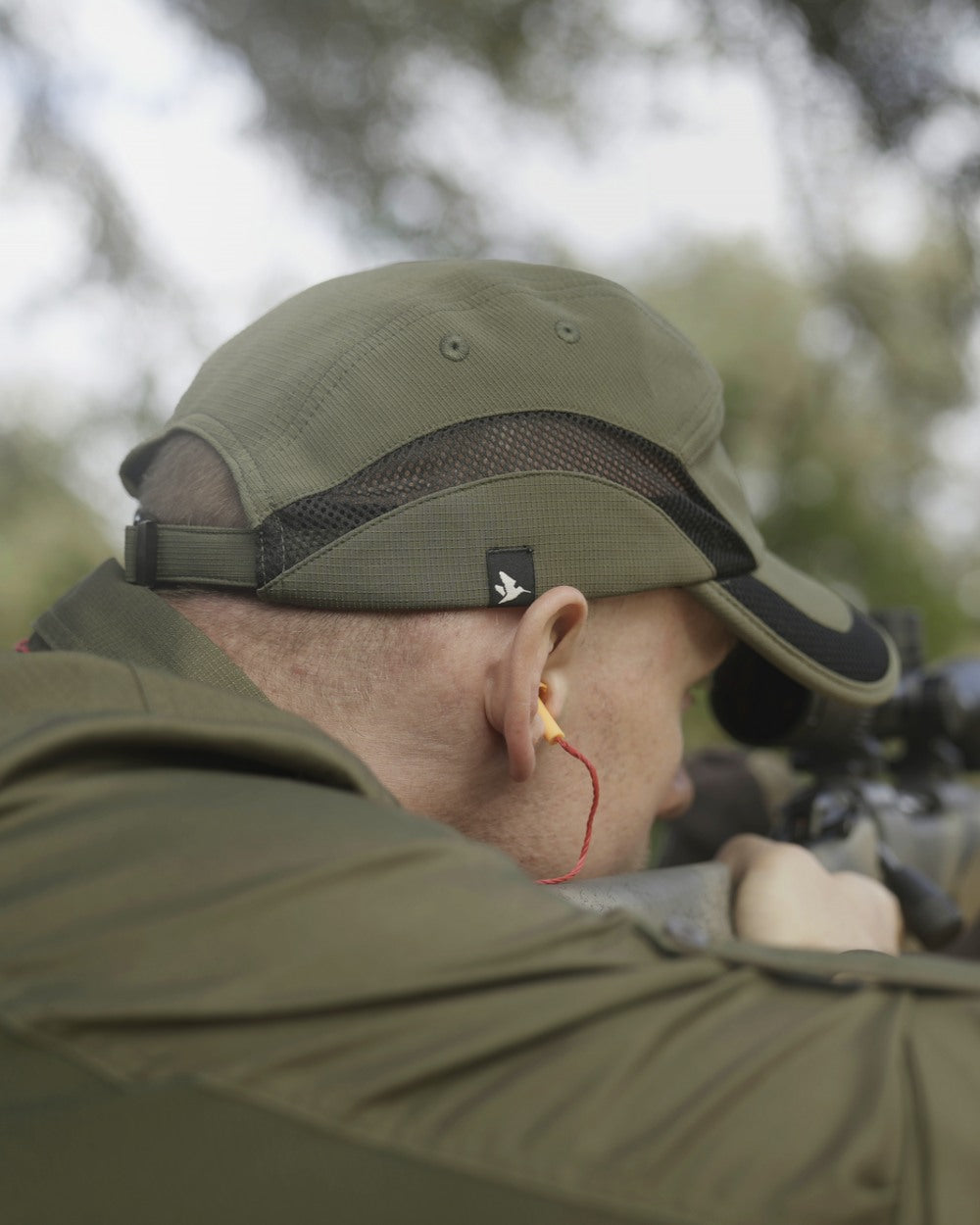 Grape Leaf Coloured Seeland Selous Cap on forest background #colour_grape-leaf