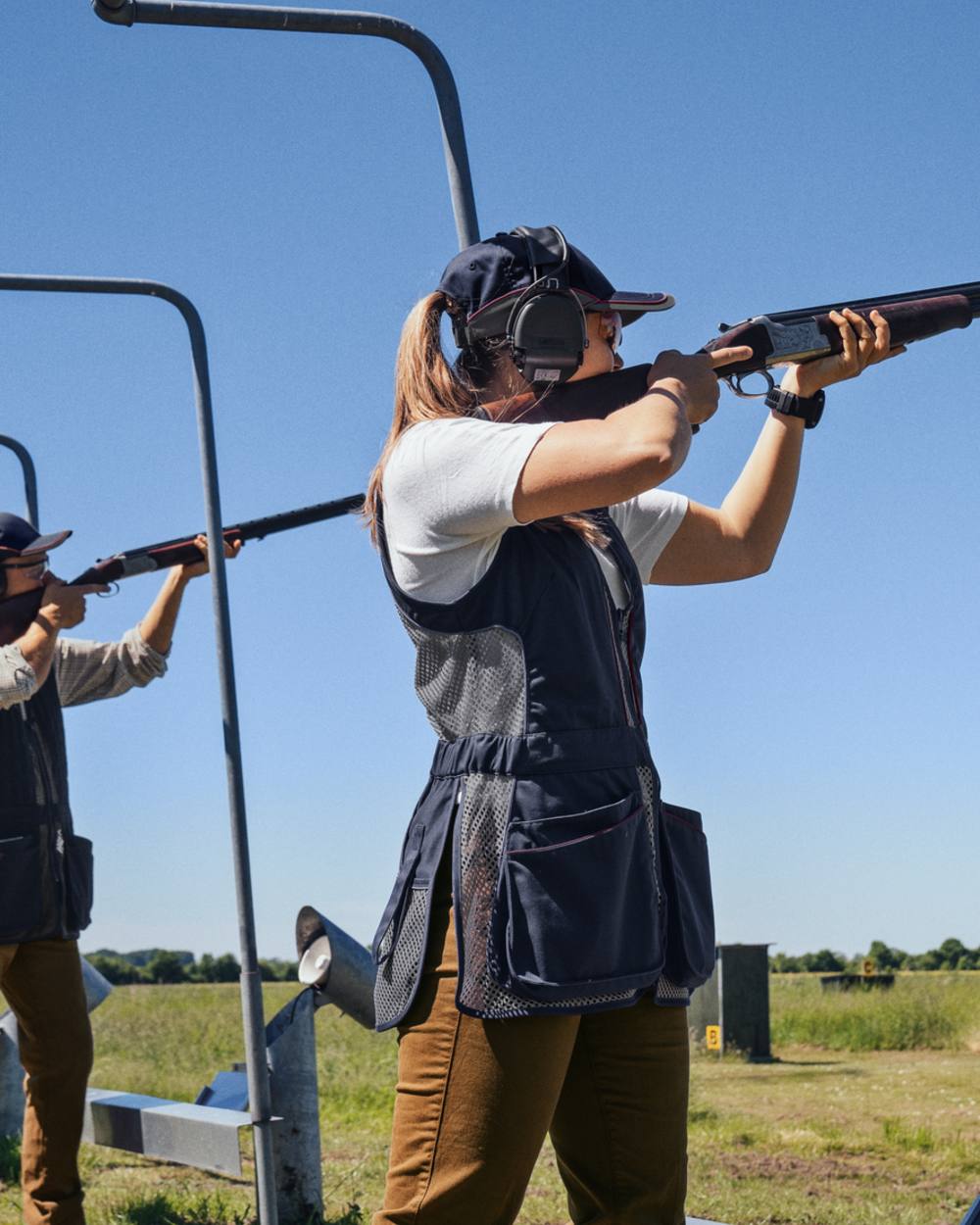 Classic Blue Coloured Seeland Skeet II Lady Waistcoat on forest background #colour_classic-blue