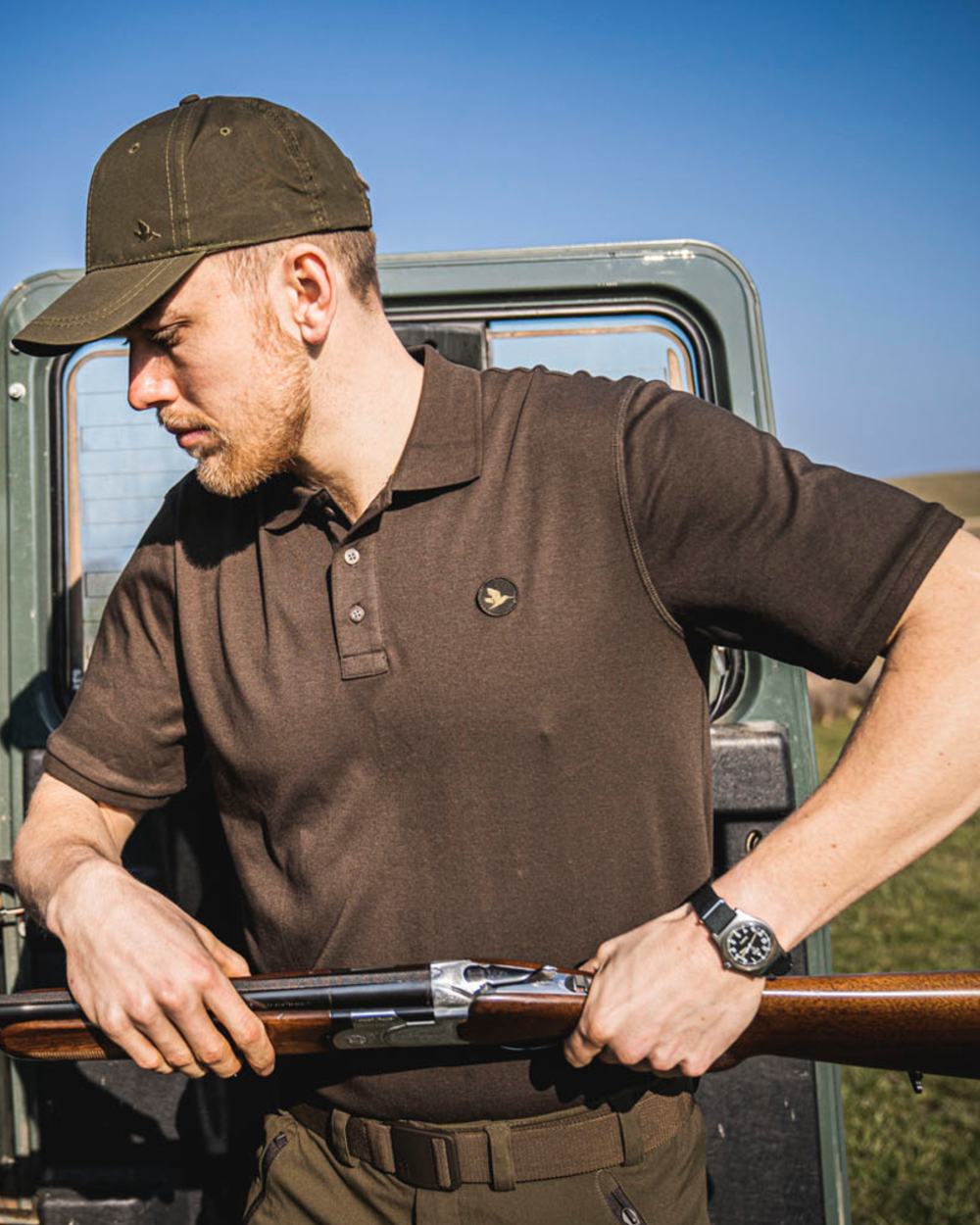 Brown Coloured Seeland Skeet Polo Shirt on outdoor background #colour_brown