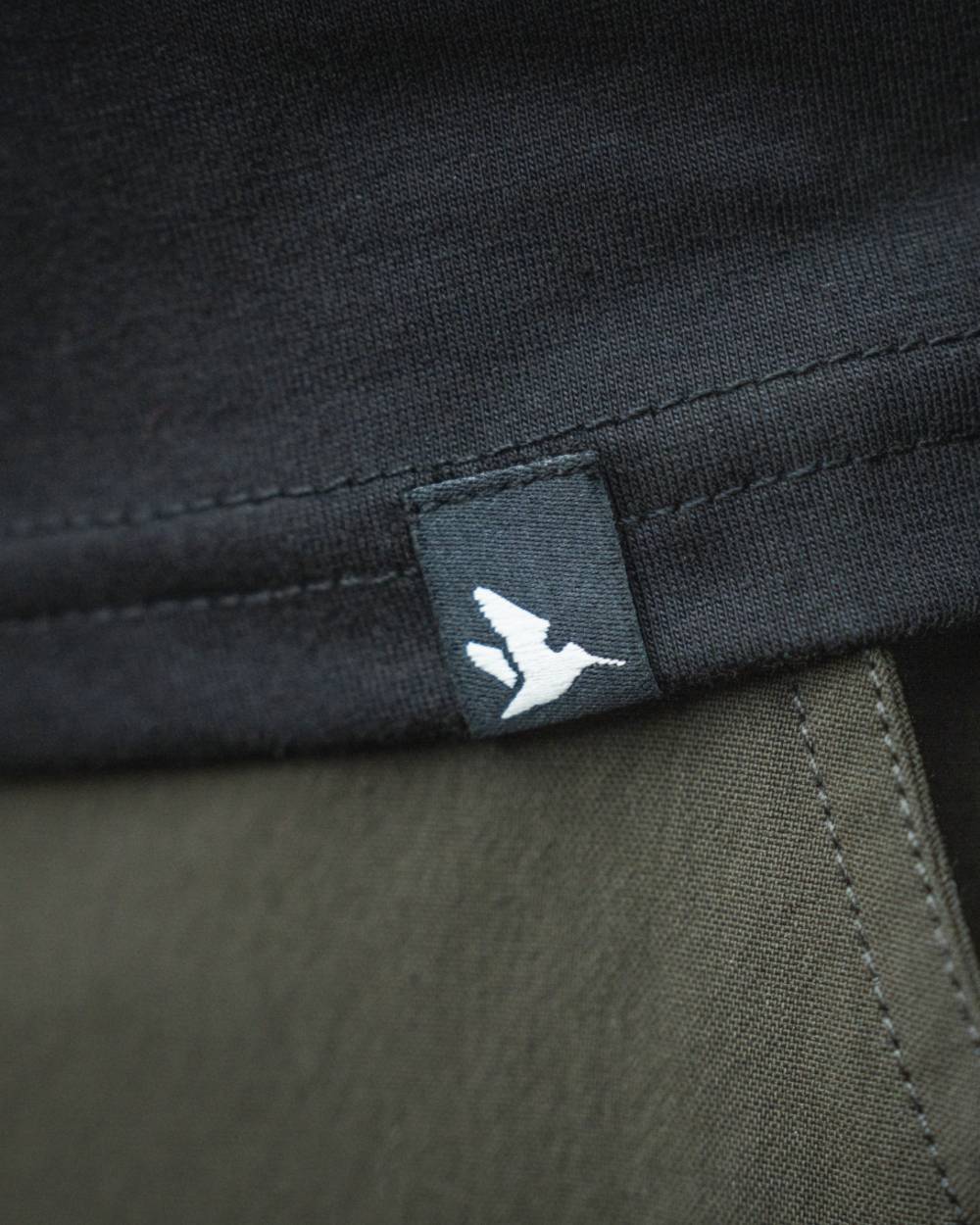 Black coloured Seeland Territory T-Shirt on white background #colour_black