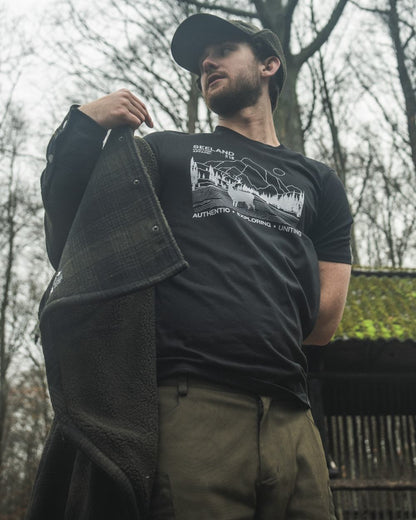 Black coloured Seeland Territory T-Shirt on forest background #colour_black